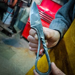 Finished Viking knife being held by the maker