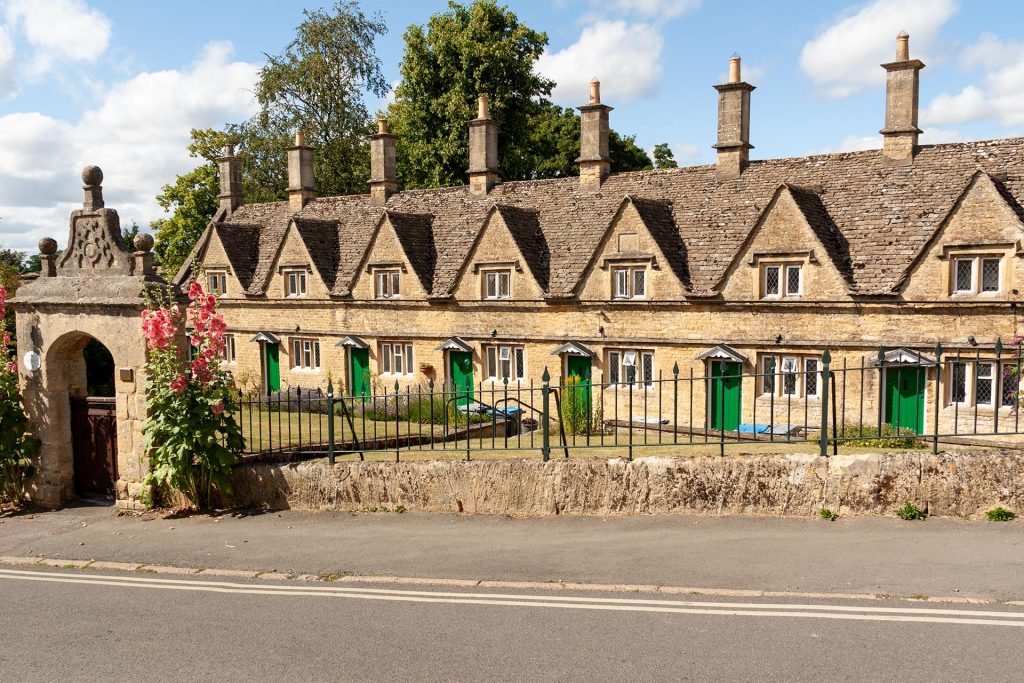 The 1640 Cornish almshouses in Chipping Norton, framed by a stone archway