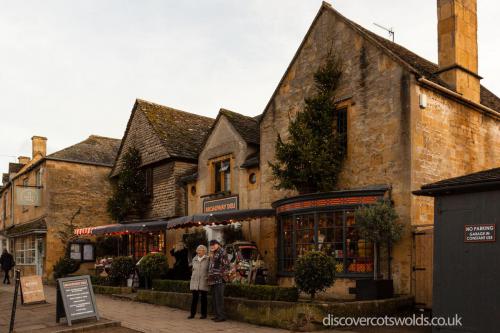 A couple stood outside Broadway Deli at Christmas time